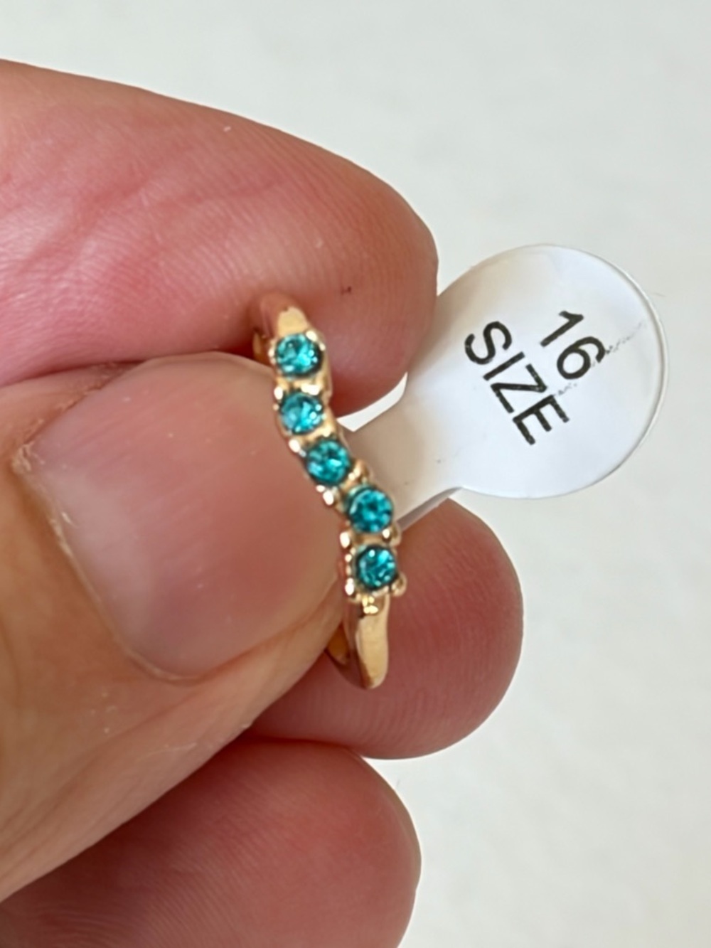 Gold Ring with Teal Stones.